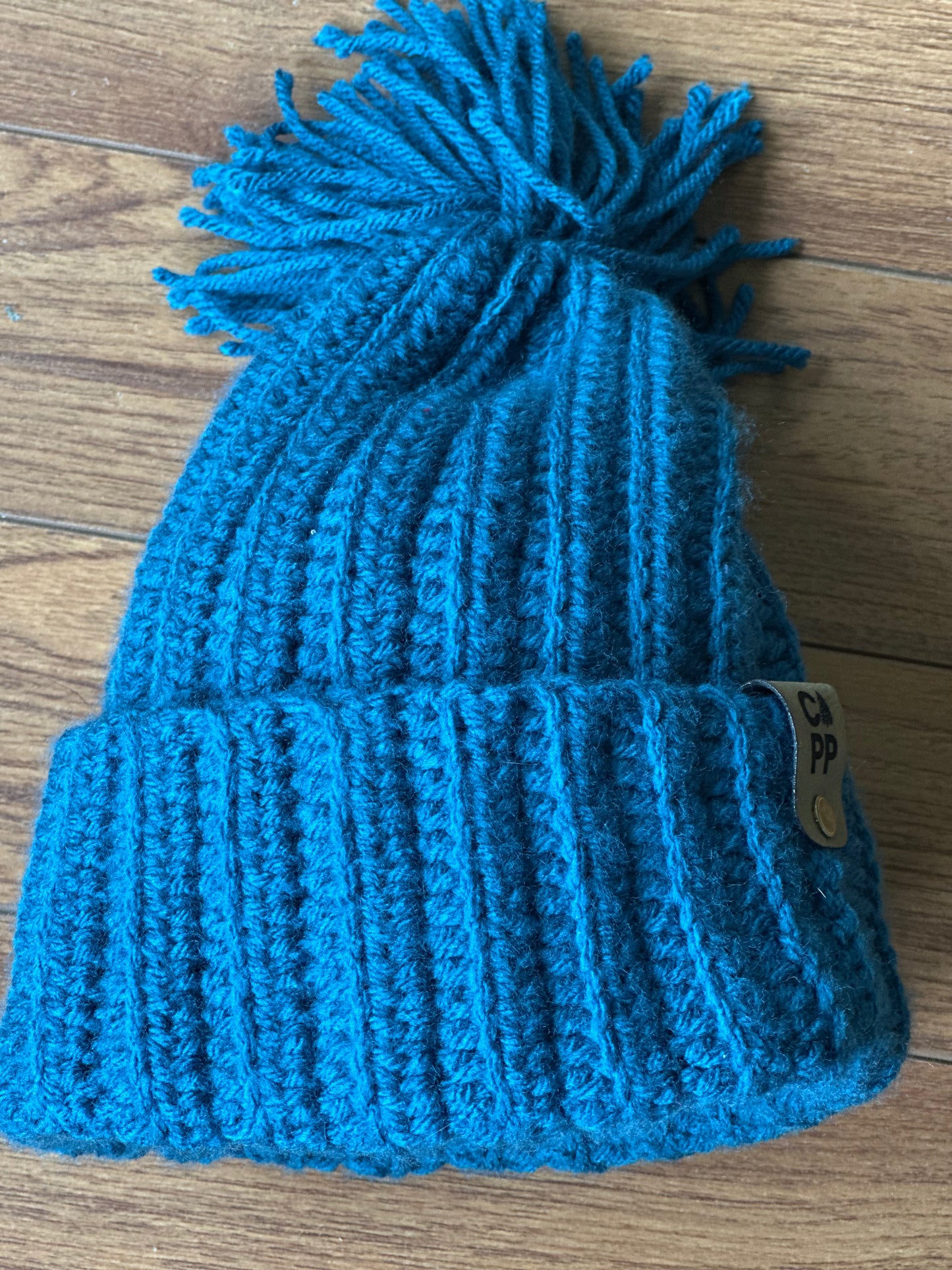 Turquoise beanie with pompom